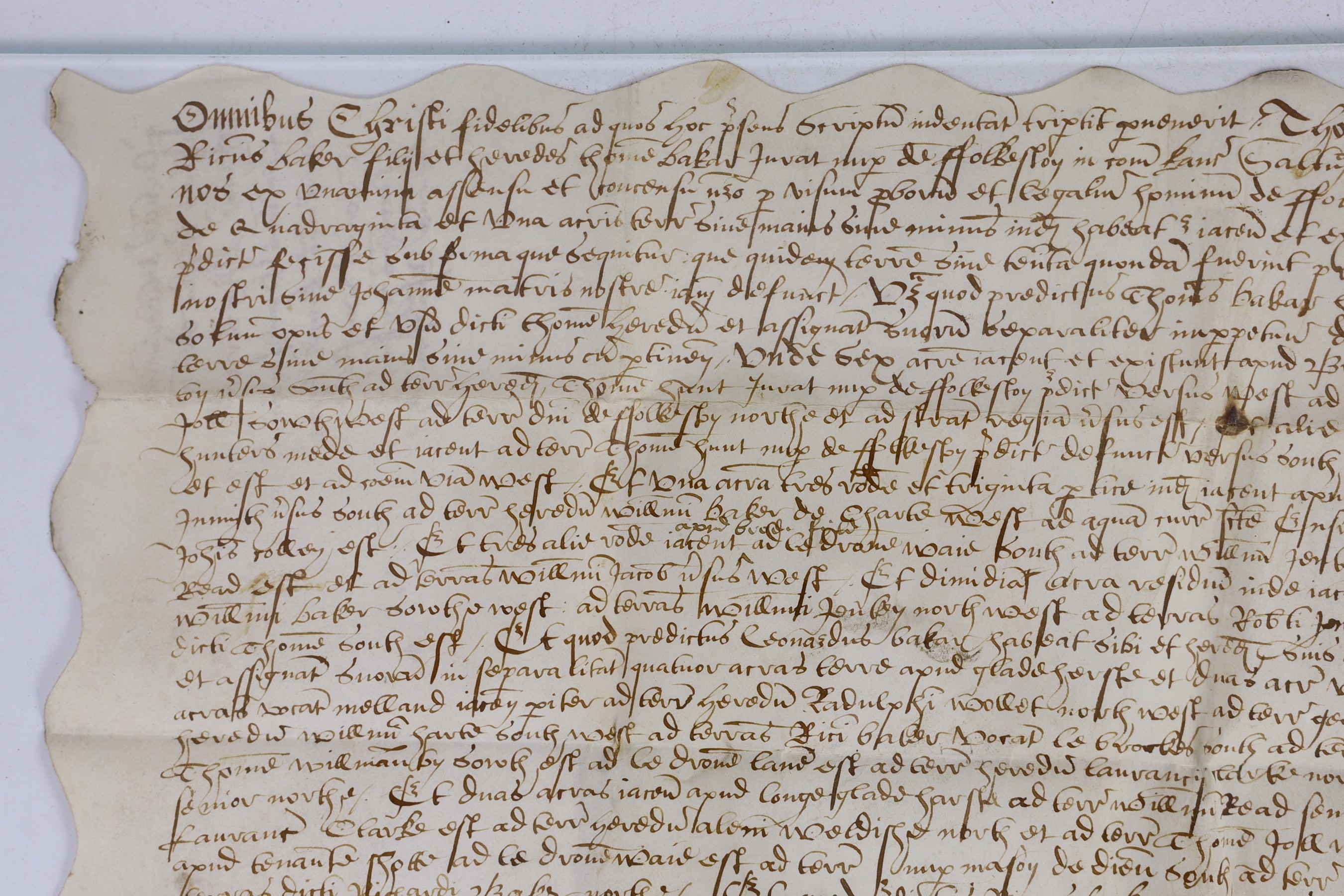 An Elizabethan charter recording the division of property, in Latin, in black ink on vellum, 30 x 37cms.